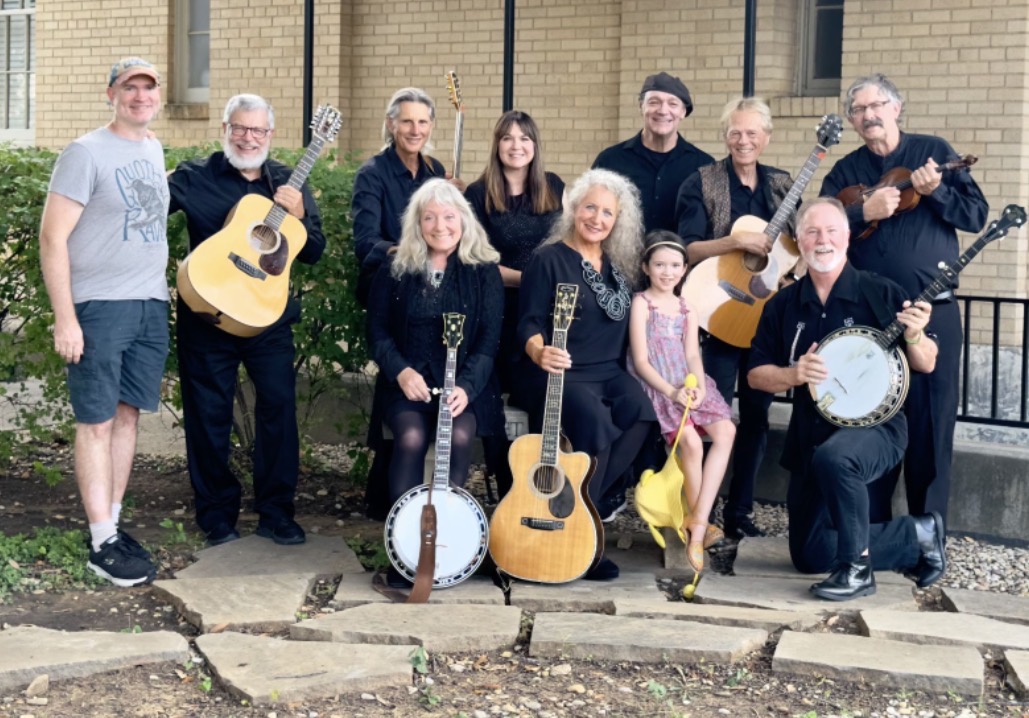 Full band group photo with guitars, banjo, violin and instruments